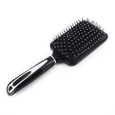 This stylish paddle hair brush is finished in black with a silver